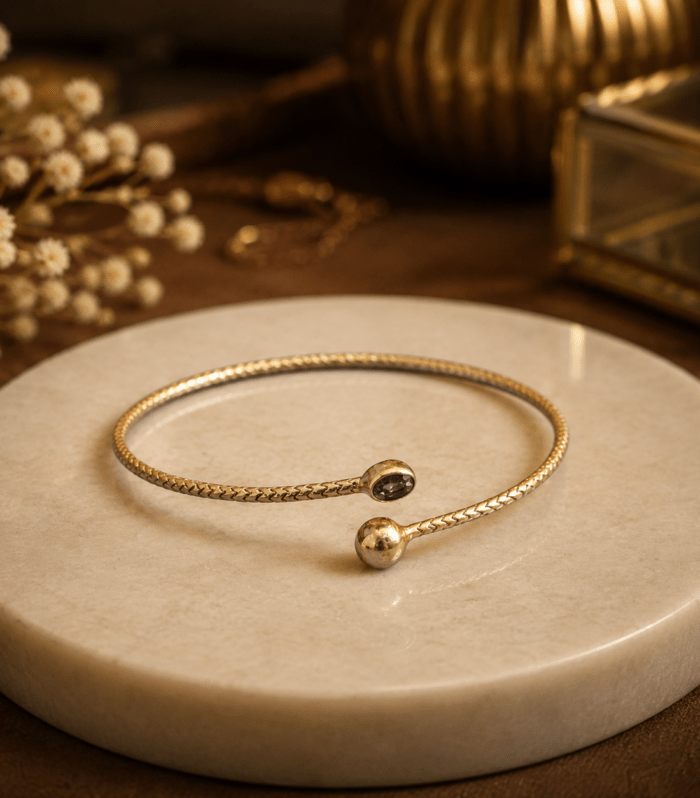 Elegant Gold-Tone Open Cuff Bracelet with Black Stone