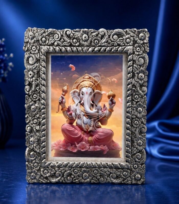 Handcrafted 999 silver sheeting Ganesha photo frame with intricate floral engravings Gokulam Signature Jewels