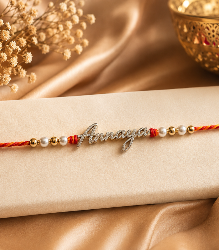 "Annaya" Script Rakhi with Pearl Beads