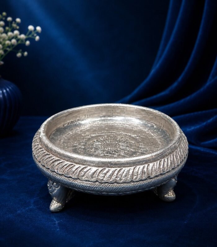 Handcrafted 999 silver sheeting urli with central mandala motif and ornate feet Gokulam Jewels